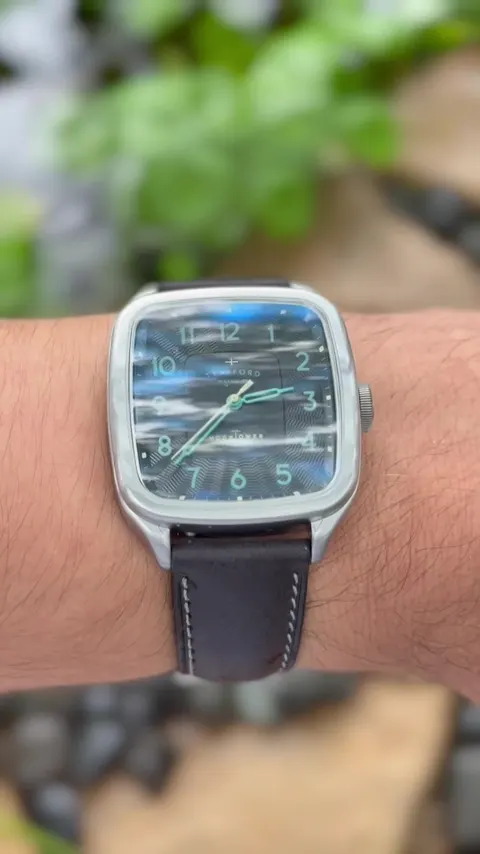 TikTok video still: Nothing like a Trafford Watch Co Moontower Limited Edition Crossroads for a rainy day like today.